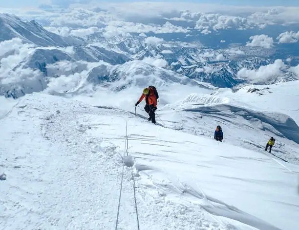 team-of-climbers-ascending-k2-mountain-together