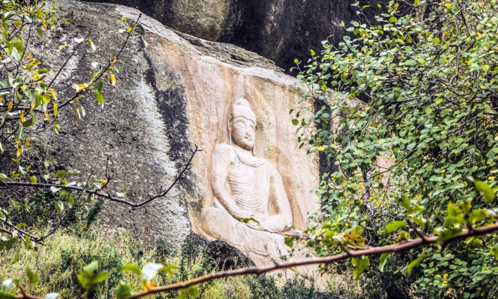 Photo of the Swat Museum exterior or a Gandhara Buddhist sculpture from its collection