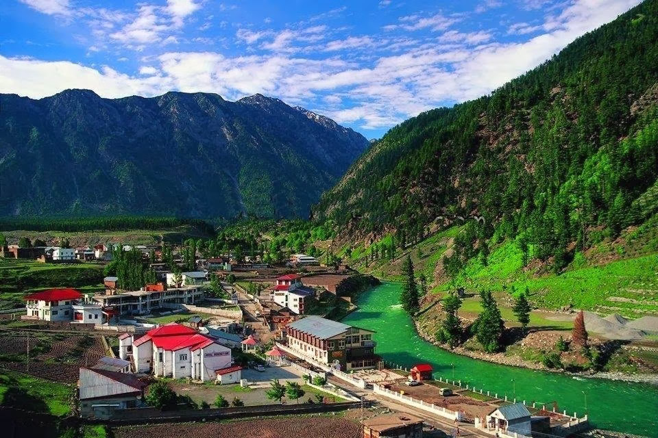 Photo of Kalam town with river and mountains visible. Or a photo of the drive from Mingora showing the Swat River and forested hills