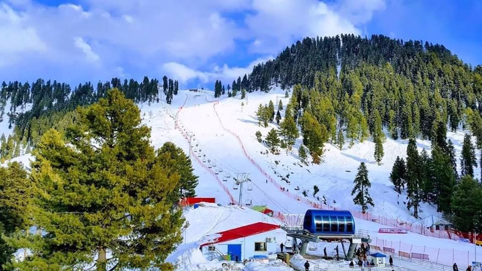 Photo of Malam Jabba ski slopes in winter with skiers, or the chairlift with mountain views.