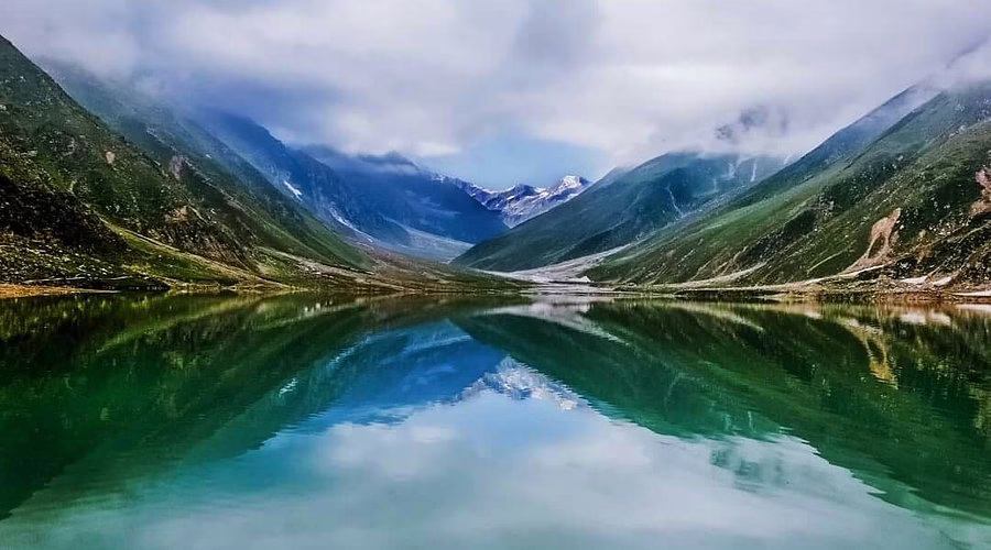 Morning photograph of Lake Saiful Mulook with Malika Parbat reflected in still water.